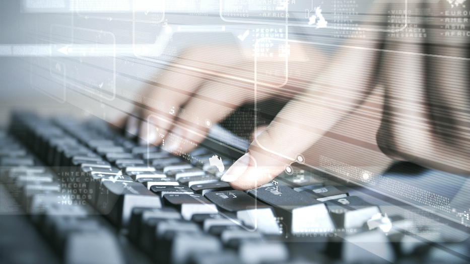 Hands typing on a keyboard